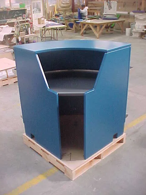 Blue fibreglass reception desk on pallet – ready for terminal installation